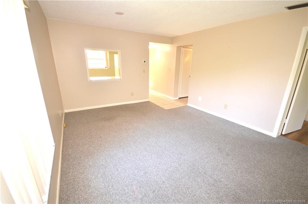 1900 South Kanner Highway, Unit 7205 Stuart, FL 34994 - Photo 7 of 25 an empty room with windows