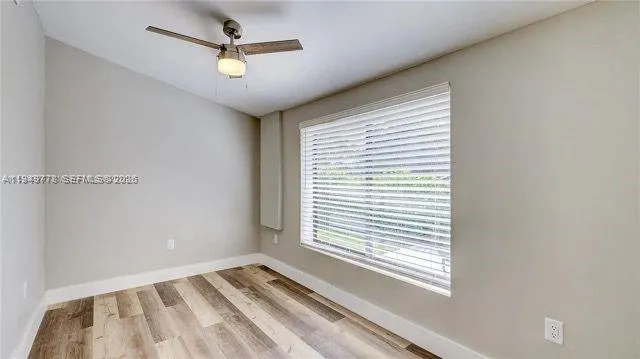 a view of an empty room with a window