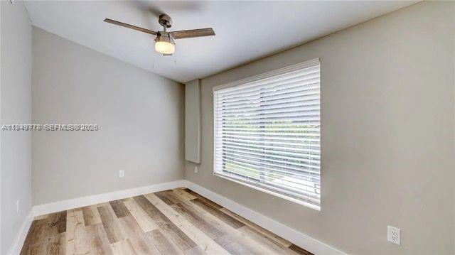 1050 Southwest 11th Street, Unit 1052 Miami, FL 33129 - Photo 4 of 10 a view of an empty room with a window