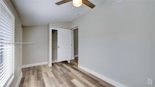 1050 Southwest 11th Street, Unit 1052 Miami, FL 33129 - Photo 7 of 10 wooden floor in an empty room