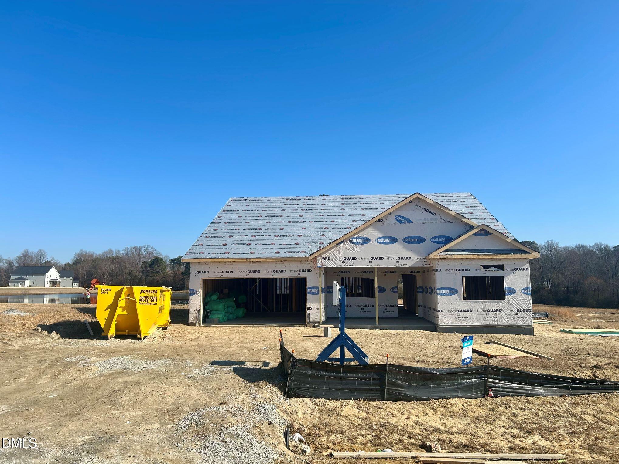 a view of a house with swimming pool and furniture