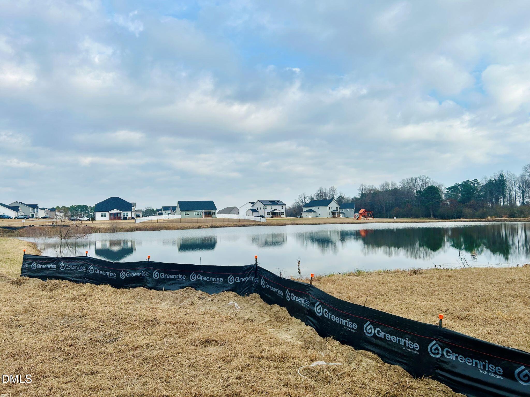 385 Denali Drive Angier, NC 27501 - Photo 4 of 19 a view of a lake from a yard