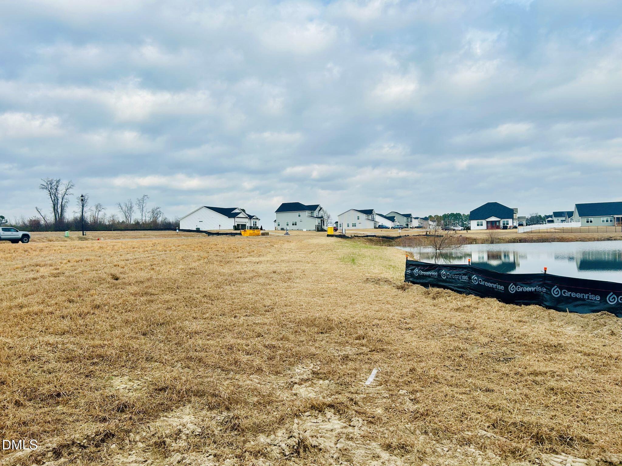 385 Denali Drive Angier, NC 27501 - Photo 5 of 19 a view of a lake with nearby beach