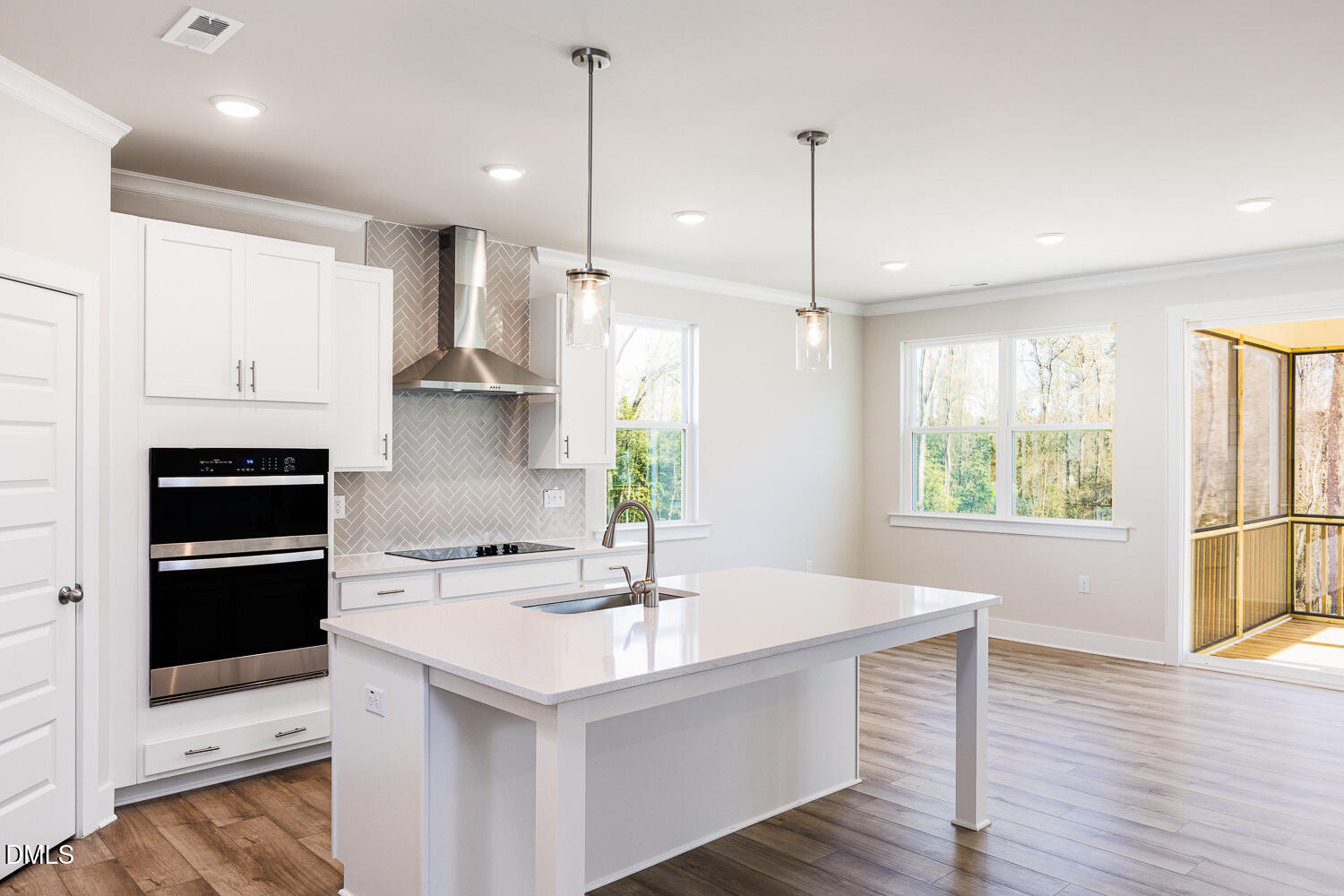385 Denali Drive Angier, NC 27501 - Photo 8 of 19 a kitchen with stainless steel appliances a sink a stove a refrigerator and window