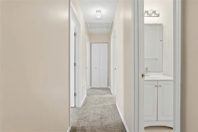 an entryway to room with wooden floor