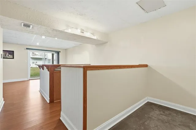 a view of entryway with wooden floor