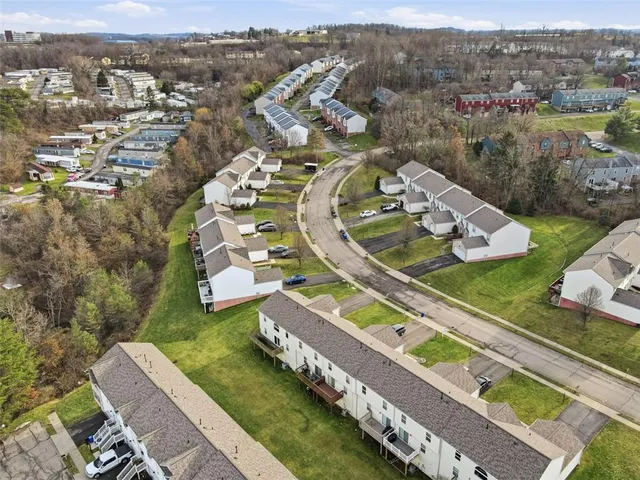 an aerial view of a house with a ocean view