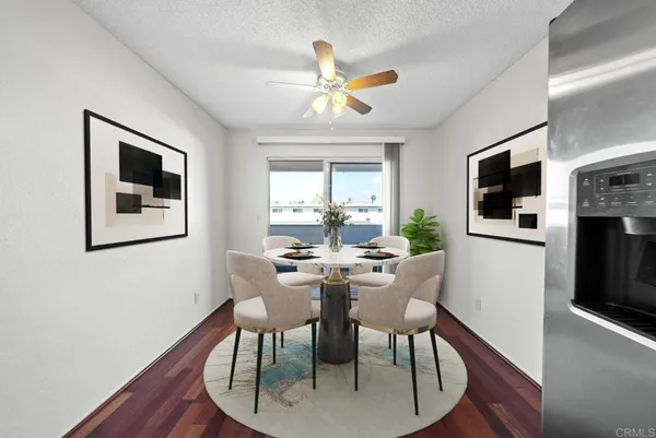 a view of a dining room with furniture window and wooden floor
