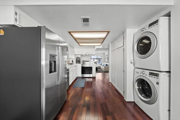a view of a kitchen with washer and dryer