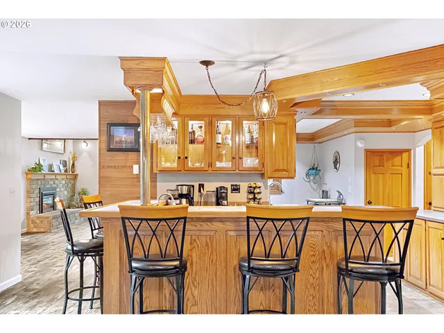a dining room with furniture a chandelier and window