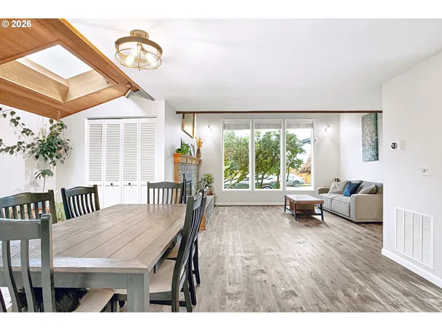 a balcony with table and chairs