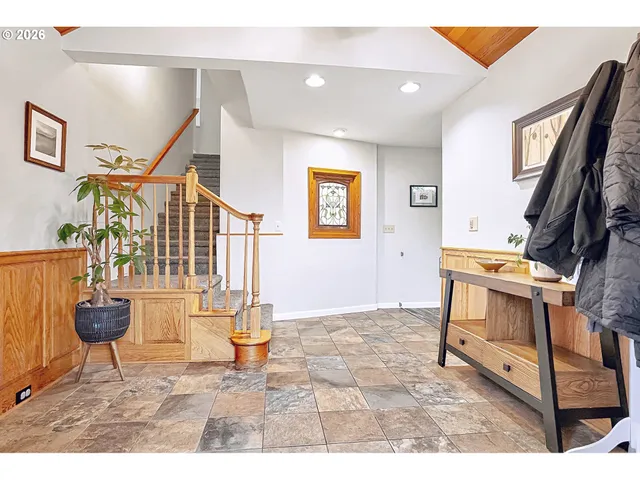 a living room with furniture and a painting