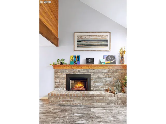 a room with a fireplace and a microwave