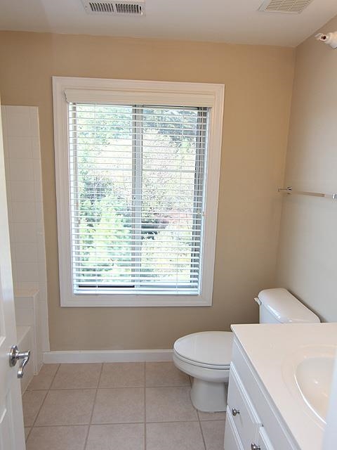 1230 Capability Drive, Unit 101 Raleigh, NC 27606 - Photo 21 of 25 Tile floors and tile surrounding shower/bath.