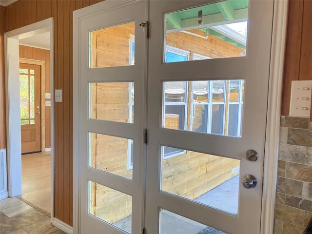 a kitchen with granite countertop a sink stove and cabinets