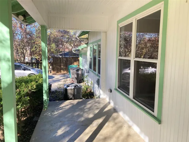 a front view of a house with outdoor seating