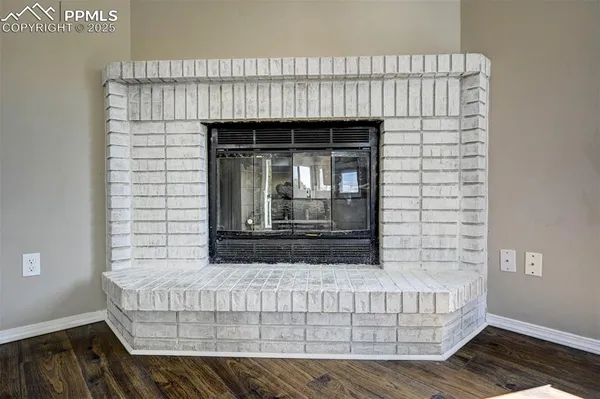 a living room with a couch and a fireplace