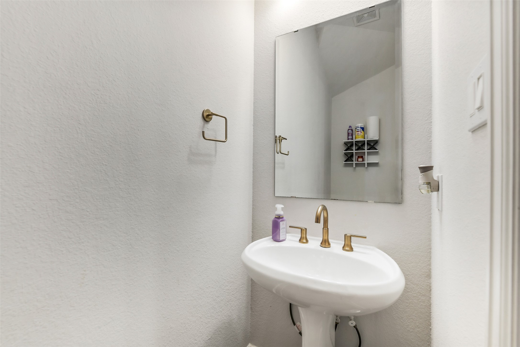 21222 Rabbitbrush Court Cypress, TX 77433 - Photo 18 of 36 a bathroom with a sink a mirror and a toilet