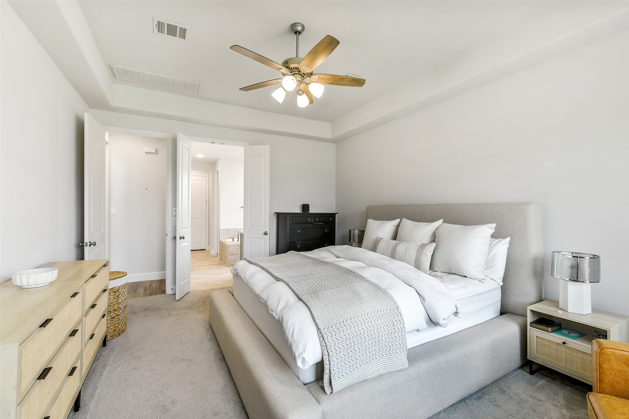 21222 Rabbitbrush Court Cypress, TX 77433 - Photo 20 of 36 a spacious bedroom with a bed and a chandelier