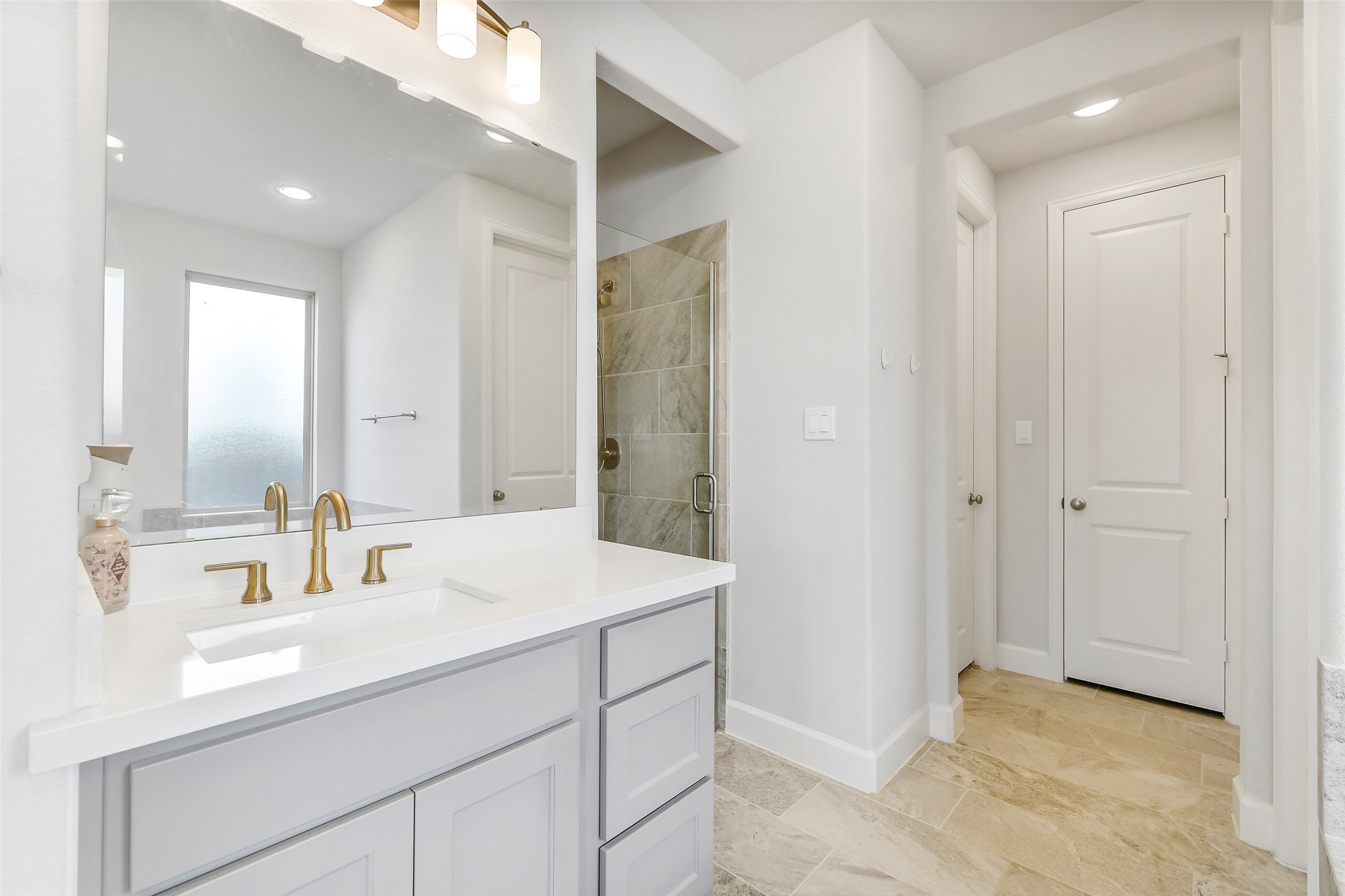 21222 Rabbitbrush Court Cypress, TX 77433 - Photo 23 of 36 a bathroom with a sink and a mirror