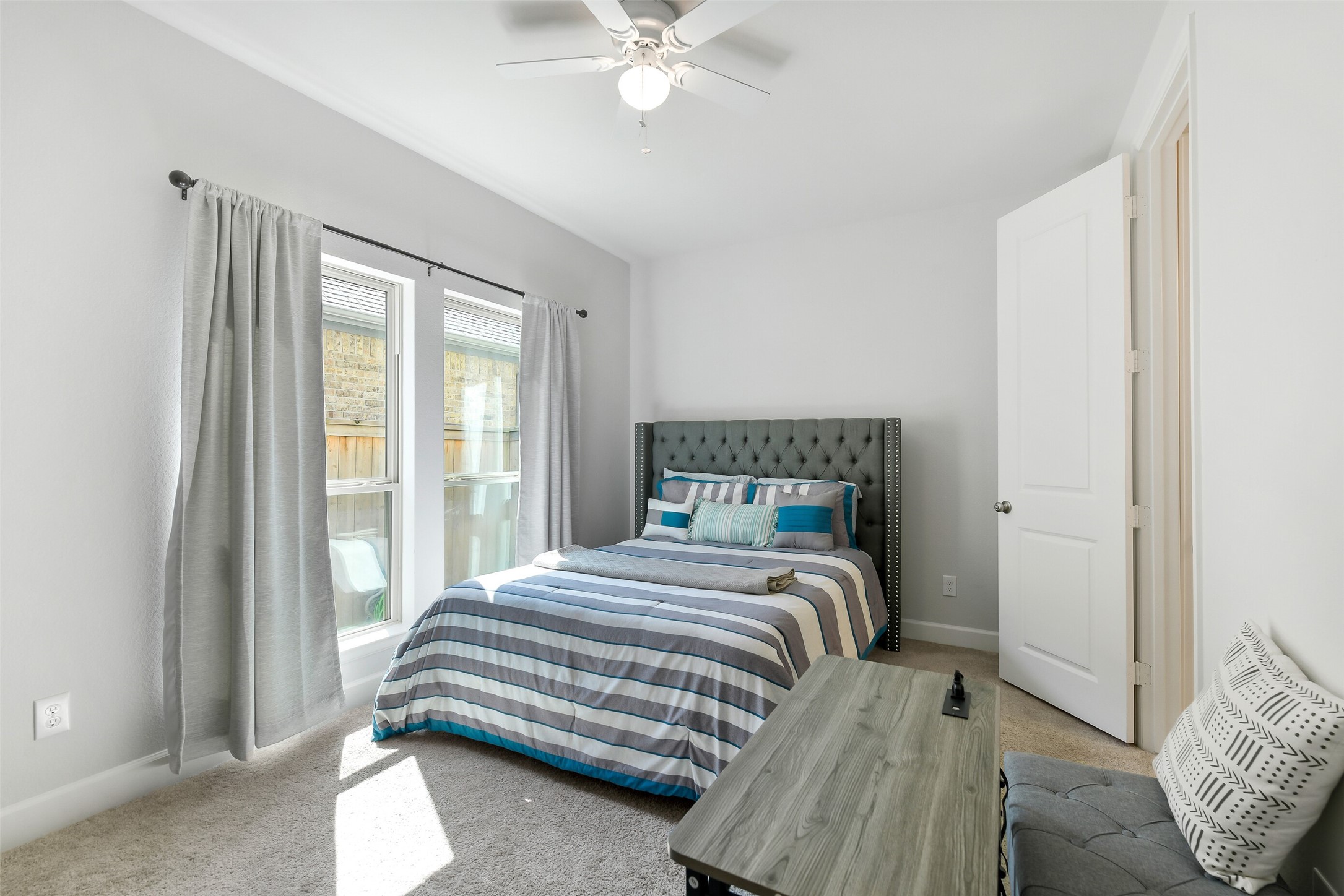 21222 Rabbitbrush Court Cypress, TX 77433 - Photo 31 of 36 a bedroom with a bed and window