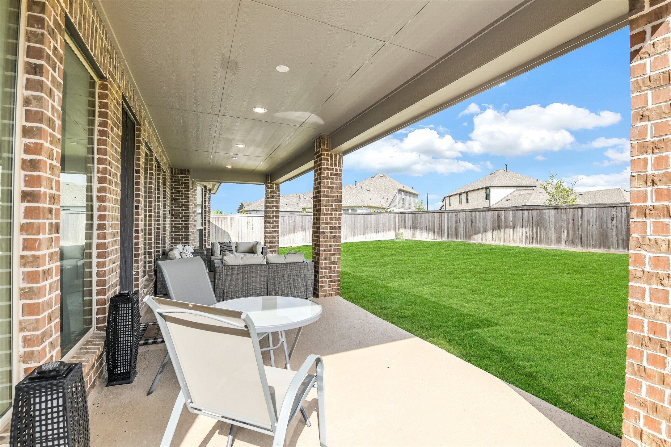 21222 Rabbitbrush Court Cypress, TX 77433 - Photo 33 of 36 a view of an outdoor dining space with a table and chairs
