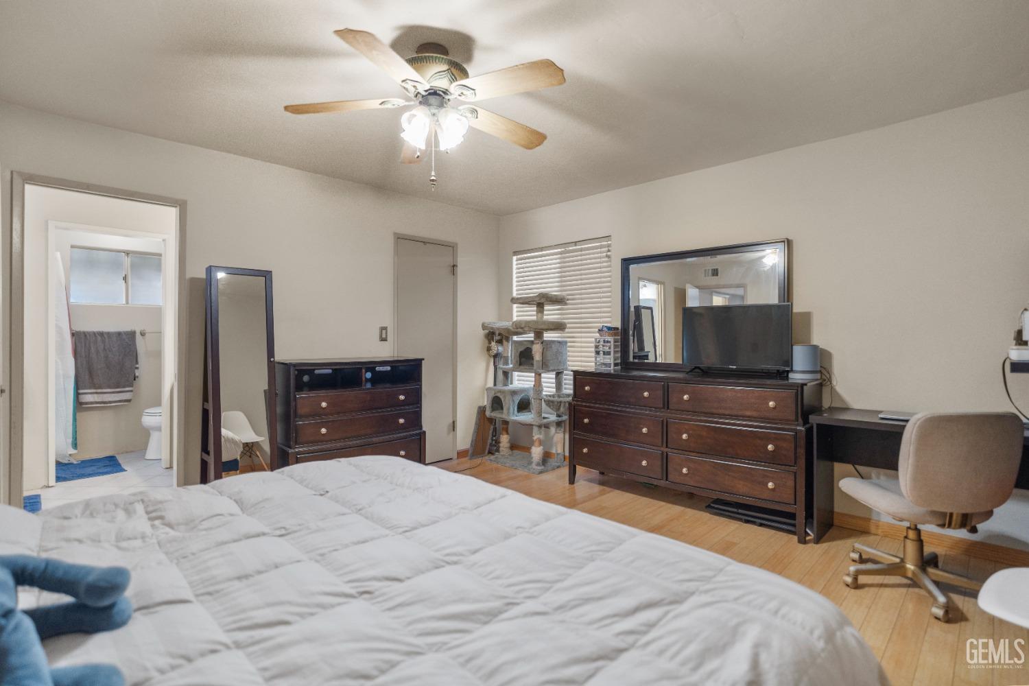 Undisclosed Address Bakersfield, CA 93313 - Photo 16 of 24 a bedroom with a bed and a flat screen tv