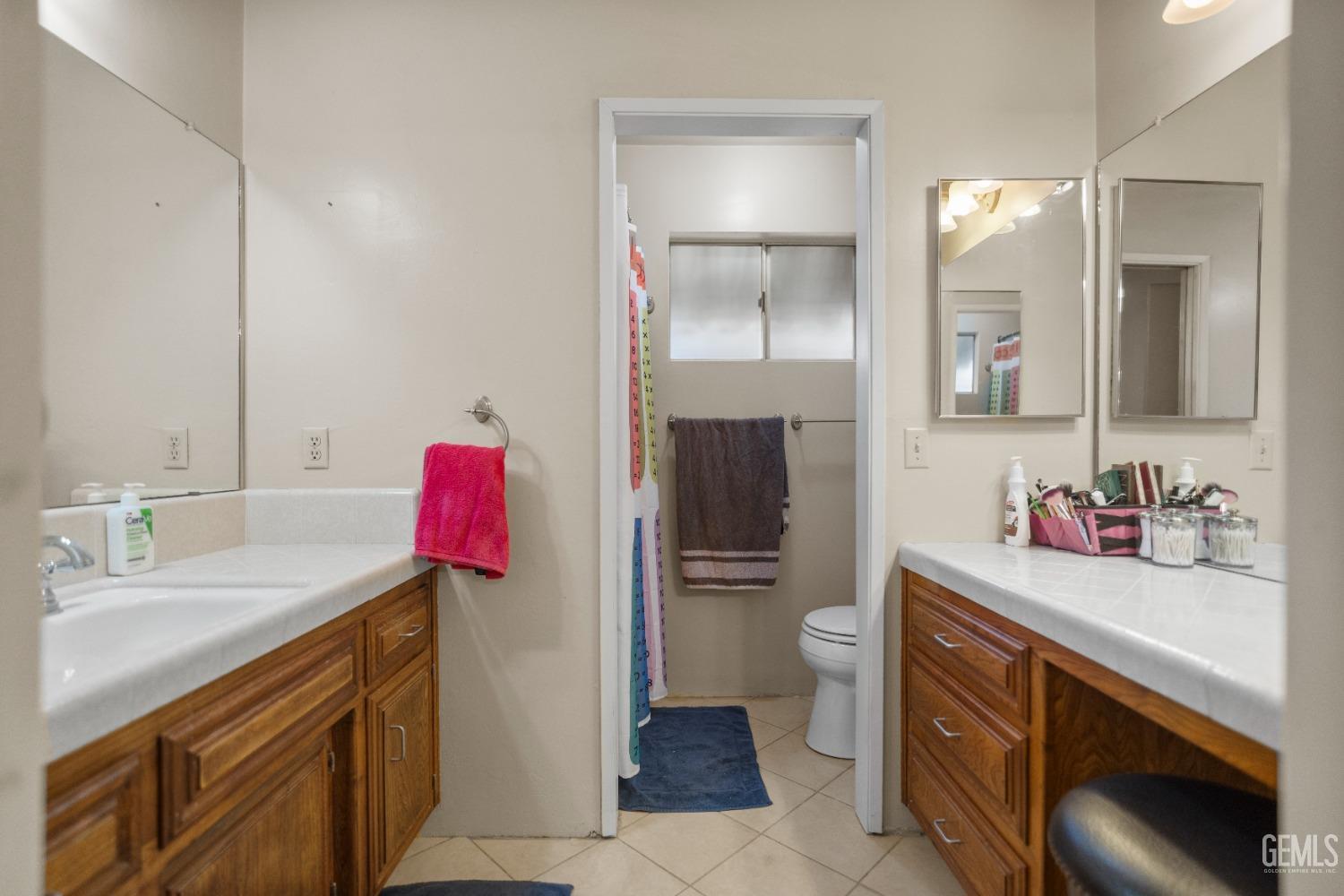 Undisclosed Address Bakersfield, CA 93313 - Photo 17 of 24 a bathroom with a sink vanity toilet and shower