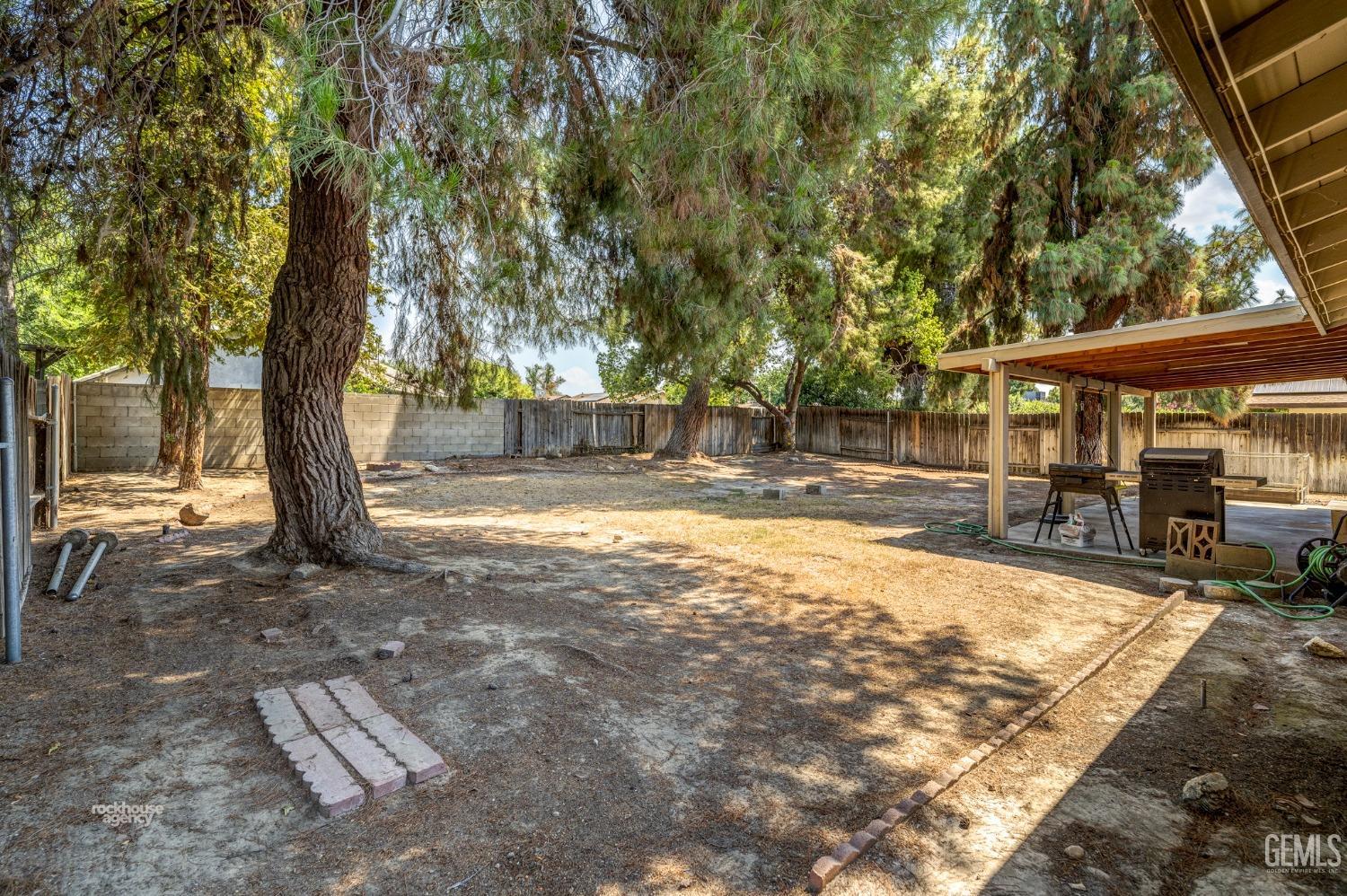 Undisclosed Address Bakersfield, CA 93313 - Photo 21 of 24 a view of a house with backyard and sitting area