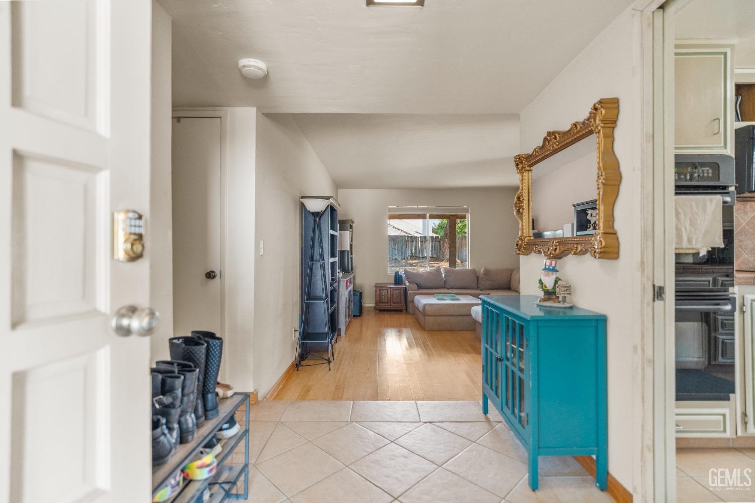 Undisclosed Address Bakersfield, CA 93313 - Photo 3 of 24 a living room with furniture and a flat screen tv