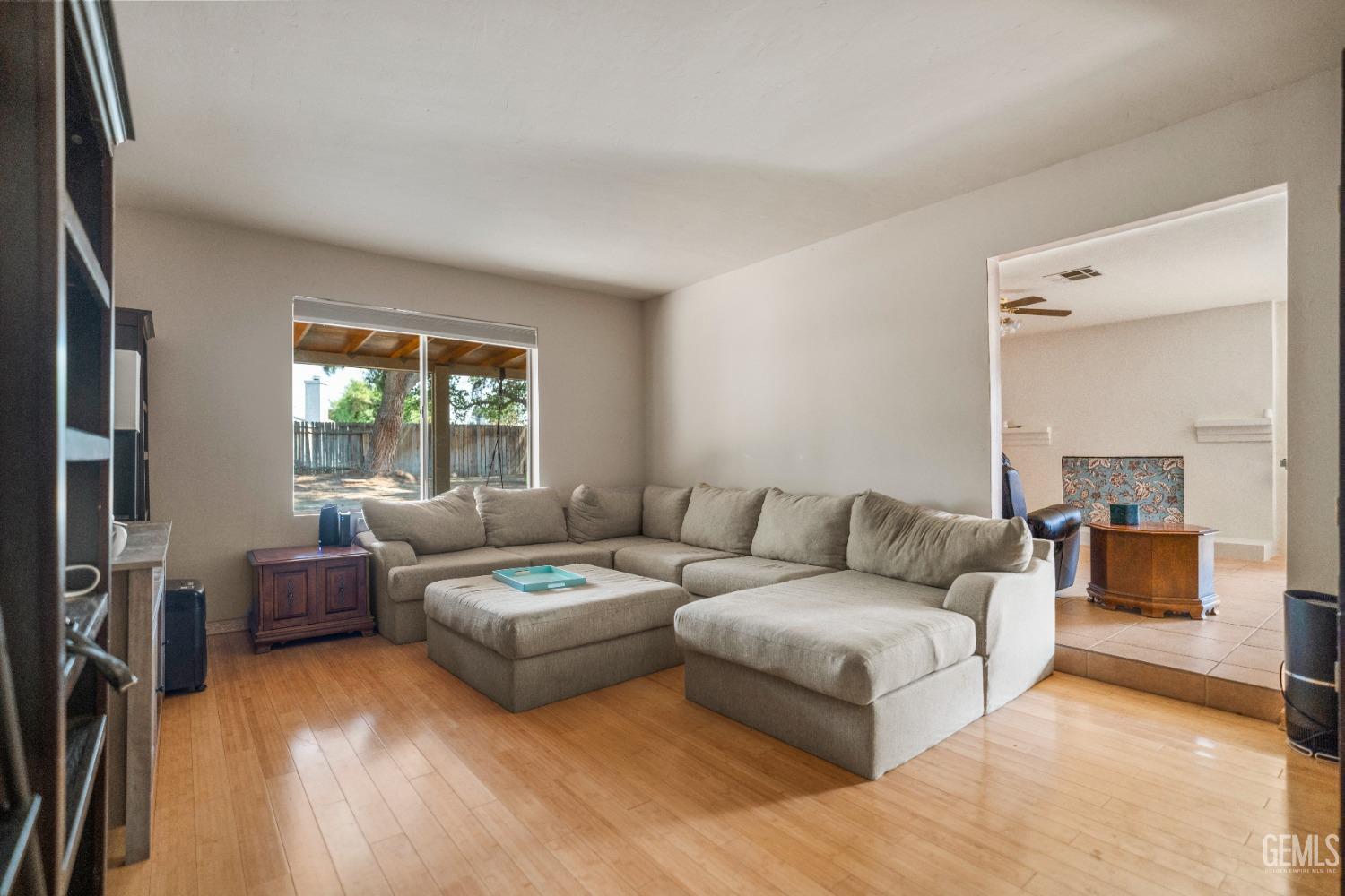 Undisclosed Address Bakersfield, CA 93313 - Photo 4 of 24 a living room with furniture and a window