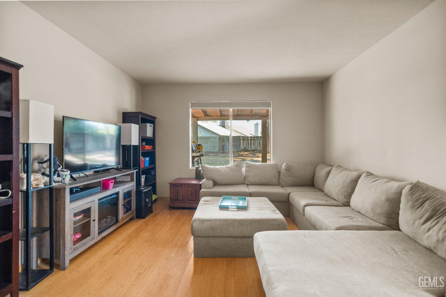 Undisclosed Address Bakersfield, CA 93313 - Photo 5 of 24 a living room with furniture and a flat screen tv