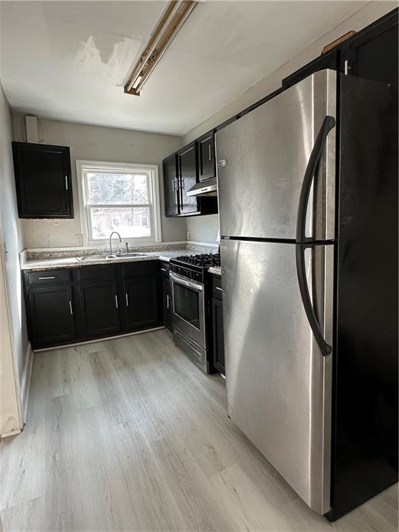 2647 Baker Ridge Drive Northwest Atlanta, GA 30318 - Photo 11 of 39 a kitchen with stainless steel appliances a refrigerator sink and microwave