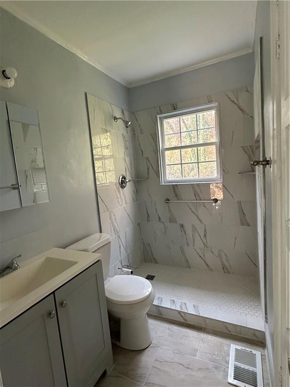 2647 Baker Ridge Drive Northwest Atlanta, GA 30318 - Photo 17 of 39 a bathroom with a toilet sink and shower