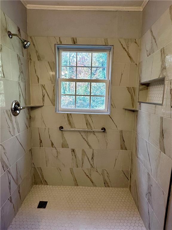 2647 Baker Ridge Drive Northwest Atlanta, GA 30318 - Photo 23 of 39 a bathroom with a bathtub and shower