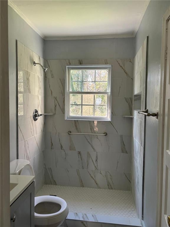 2647 Baker Ridge Drive Northwest Atlanta, GA 30318 - Photo 24 of 39 a bathroom with a granite countertop shower and a toilet