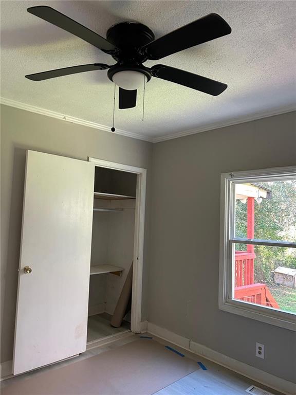 2647 Baker Ridge Drive Northwest Atlanta, GA 30318 - Photo 25 of 39 a view of a livingroom with a ceiling fan and window