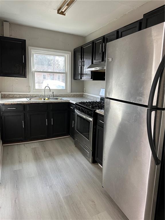 2647 Baker Ridge Drive Northwest Atlanta, GA 30318 - Photo 7 of 39 a kitchen with granite countertop a refrigerator a sink a stove a microwave a counter top and cabinetry