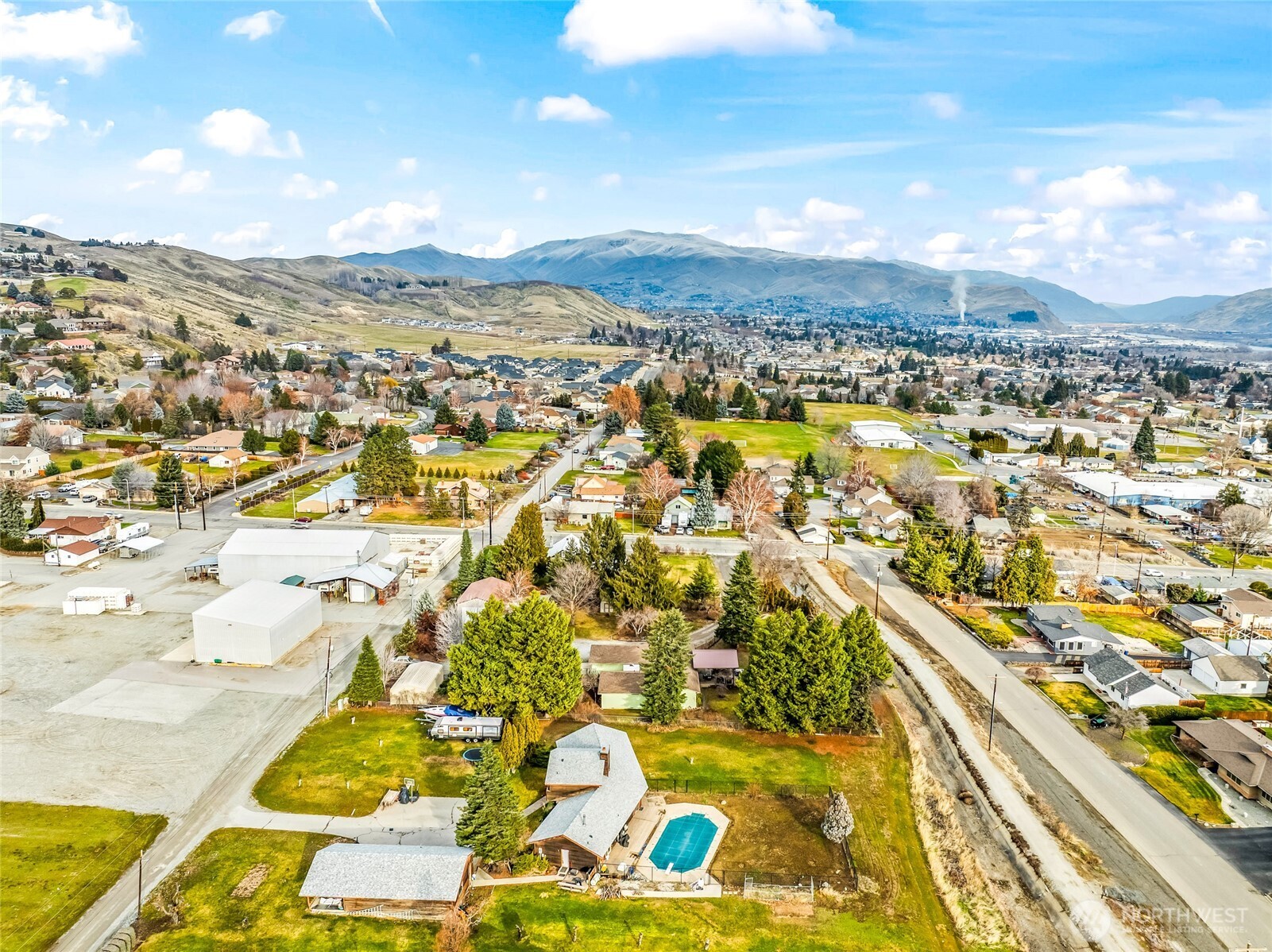 1919 B Fifth Street Wenatchee, WA 98801 - Photo 11 of 40 an aerial view of residential houses with outdoor space