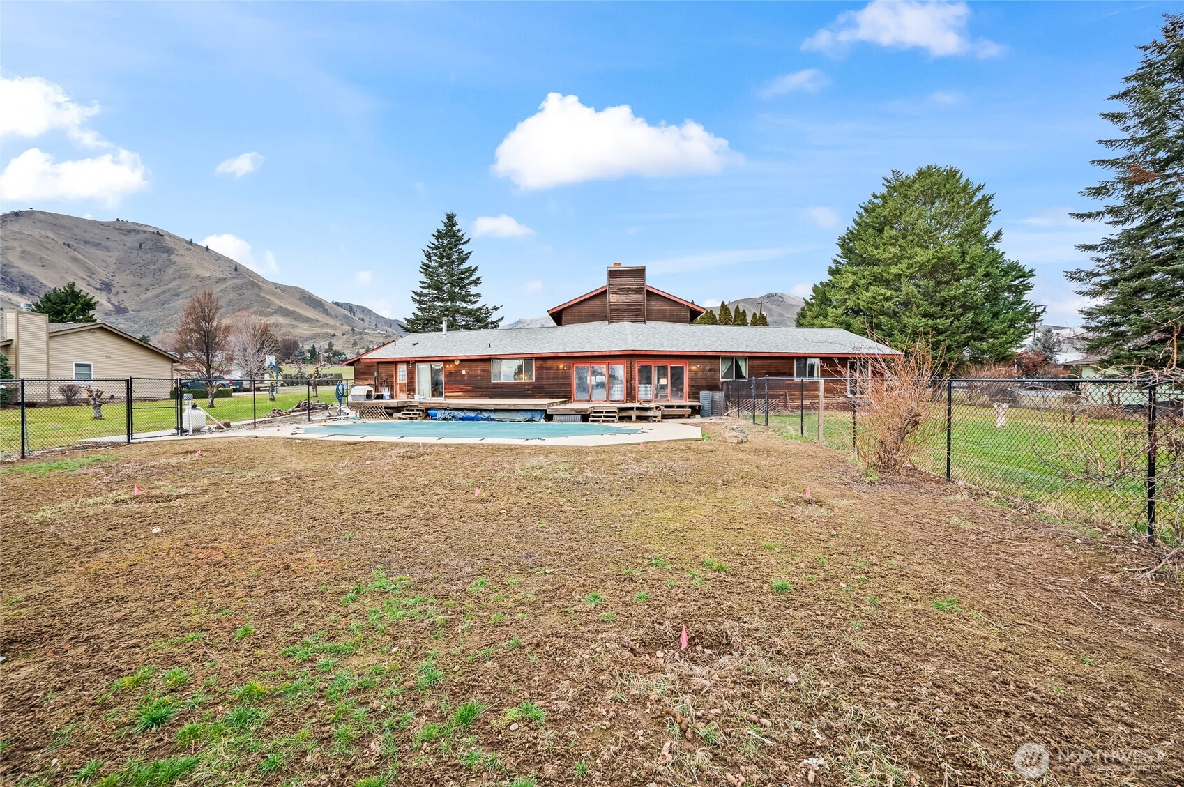 1919 B Fifth Street Wenatchee, WA 98801 - Photo 15 of 40 a front view of a house with a yard
