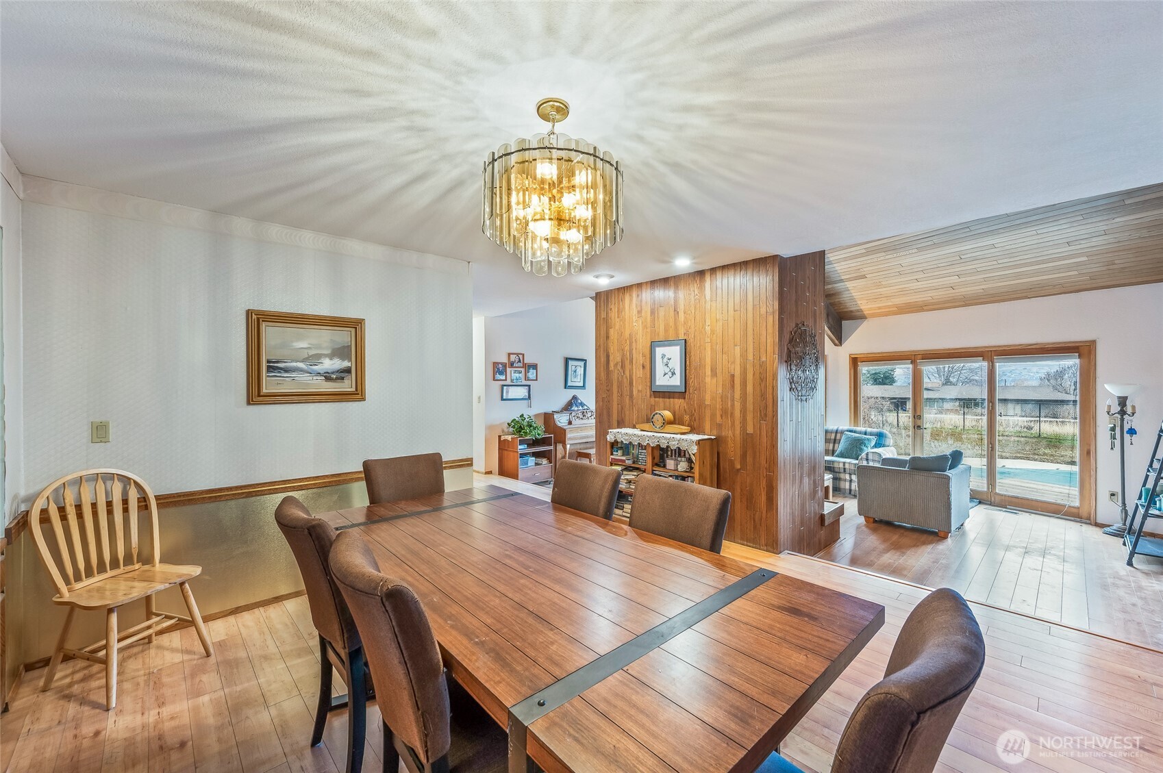 1919 B Fifth Street Wenatchee, WA 98801 - Photo 21 of 40 a view of a dining room with furniture a chandelier and wooden floor