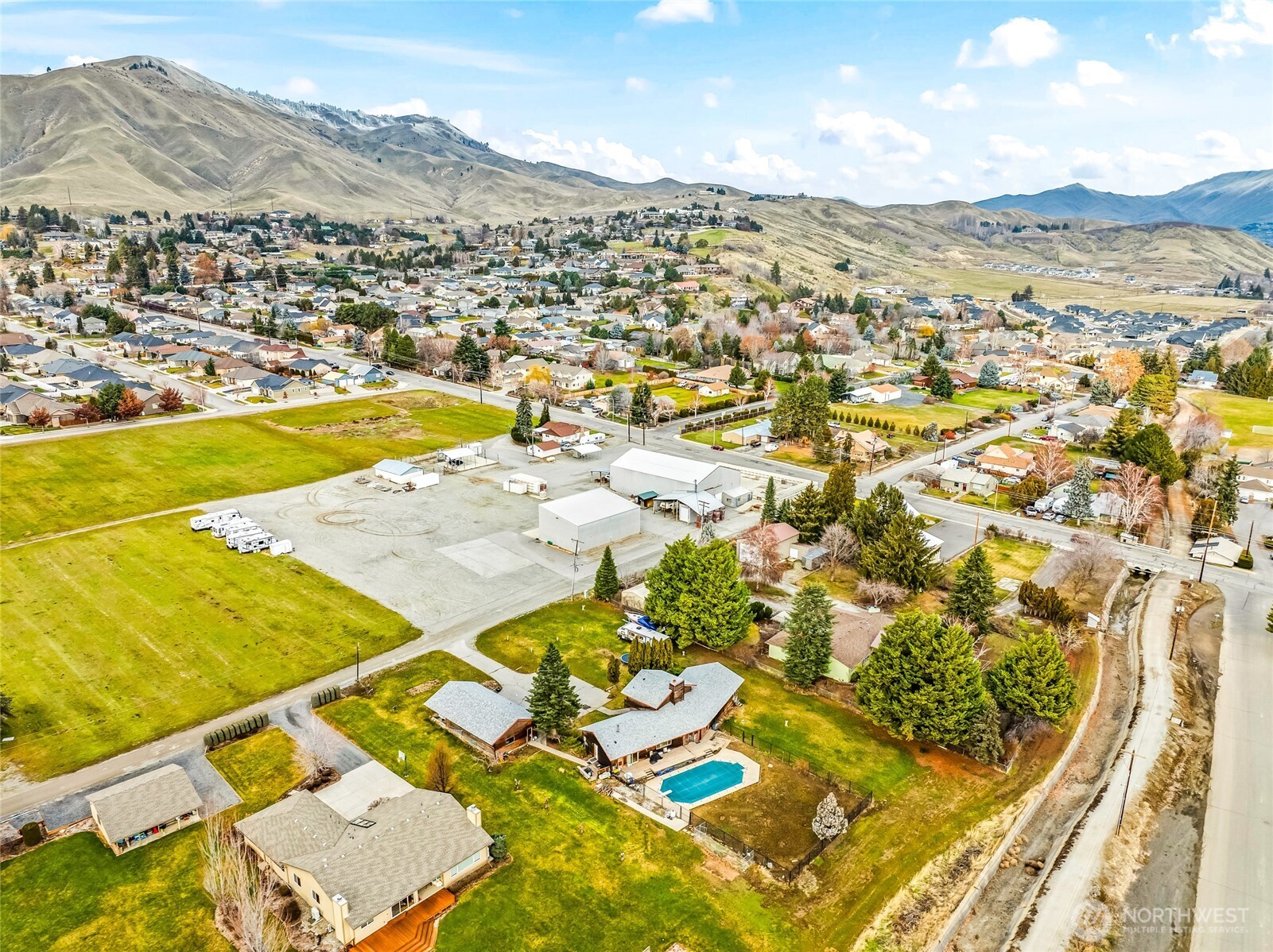 1919 B Fifth Street Wenatchee, WA 98801 - Photo 7 of 40 an aerial view of residential houses with outdoor space