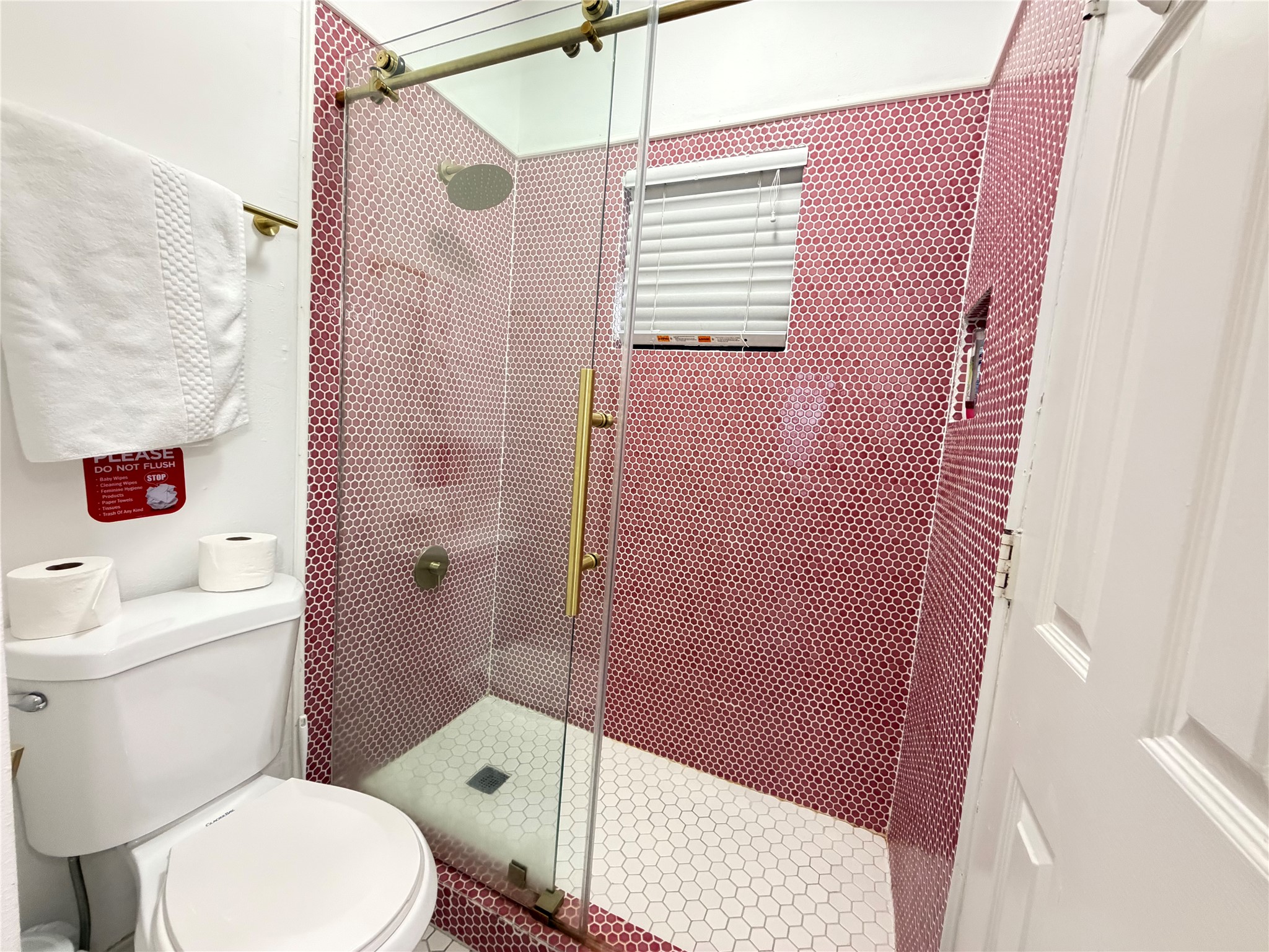 2509 Pearl Street, Unit 7 Austin, TX 78705 - Photo 15 of 23 a white toilet sitting next to a bathroom sink