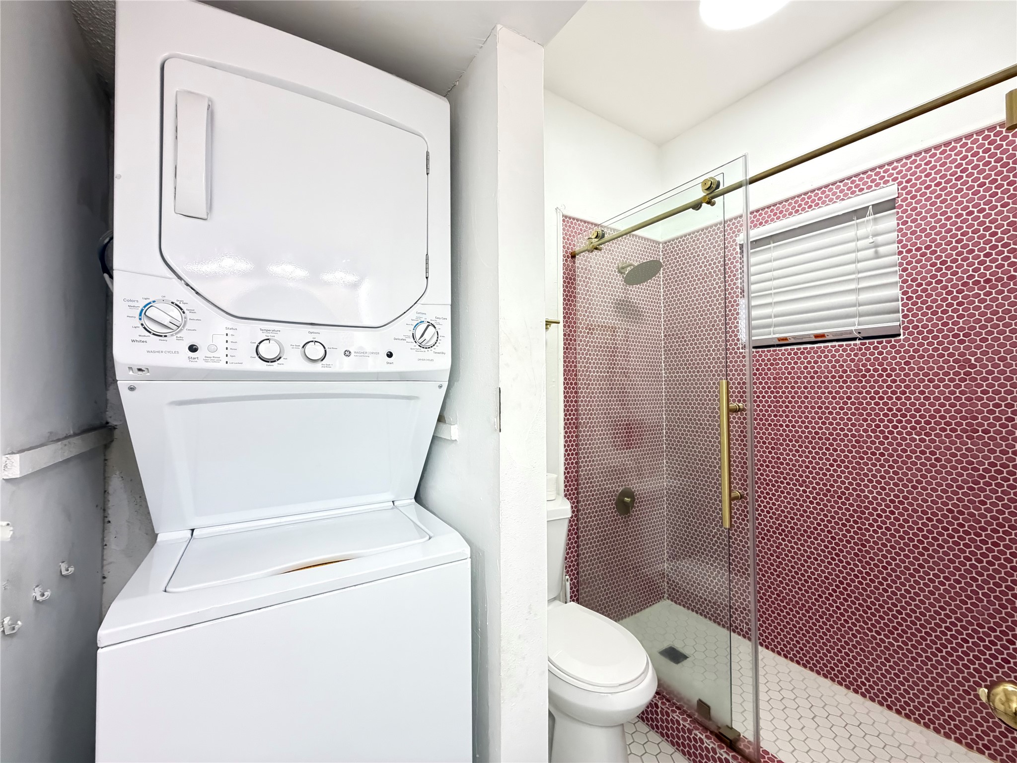 2509 Pearl Street, Unit 7 Austin, TX 78705 - Photo 16 of 23 a bathroom with a toilet and a shower