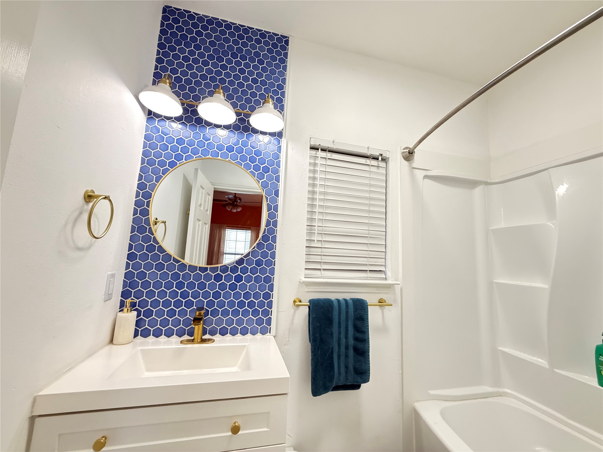 2509 Pearl Street, Unit 7 Austin, TX 78705 - Photo 18 of 23 a bathroom with a sink and a mirror