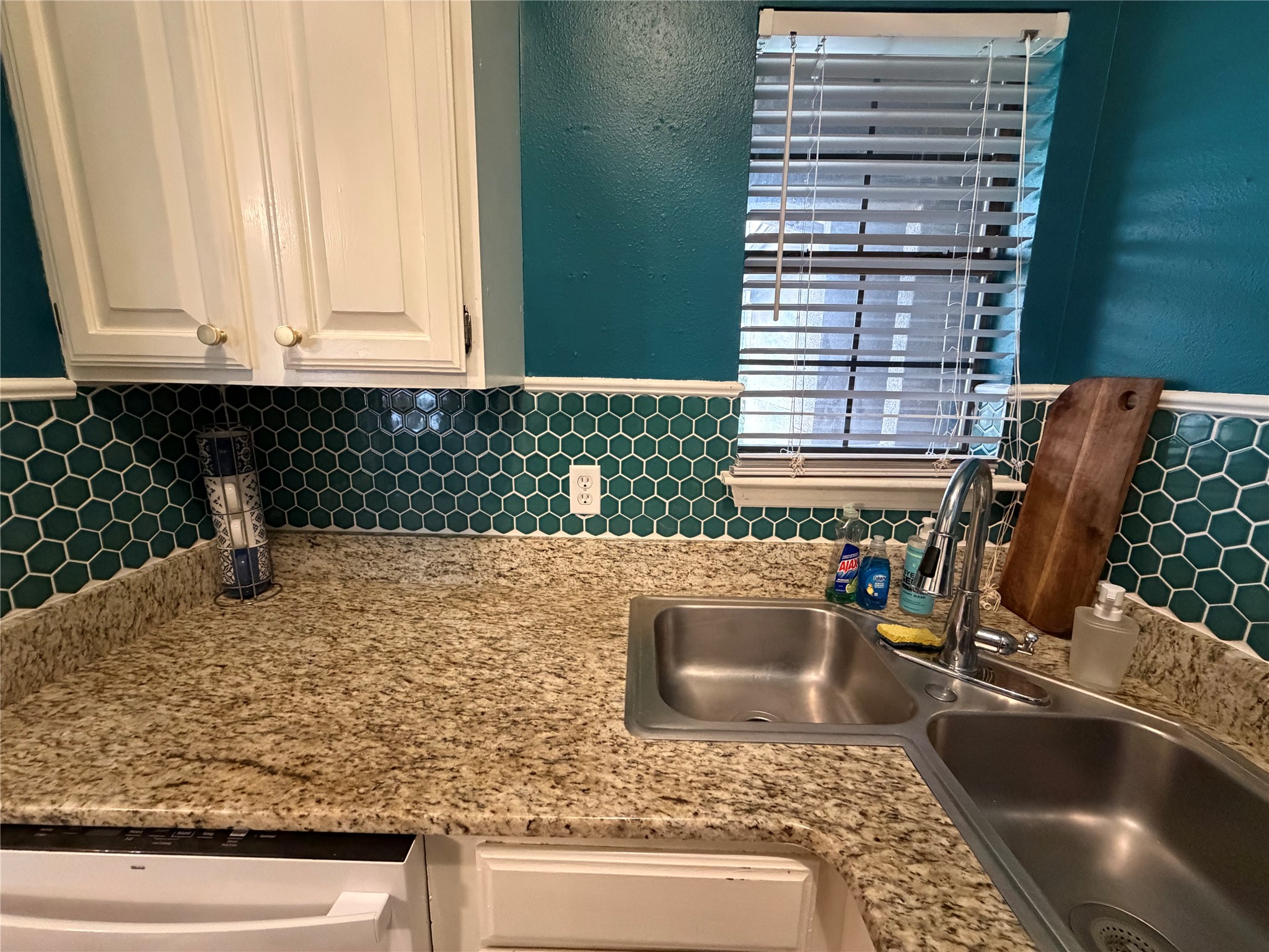 2509 Pearl Street, Unit 7 Austin, TX 78705 - Photo 5 of 23 a bathroom with a granite countertop sink and a bathtub