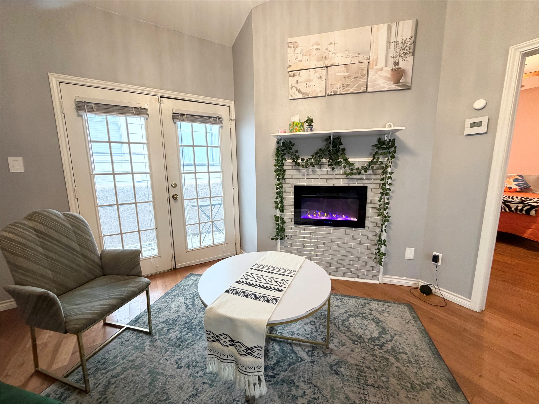 2509 Pearl Street, Unit 7 Austin, TX 78705 - Photo 10 of 23 a living room with furniture and a fireplace