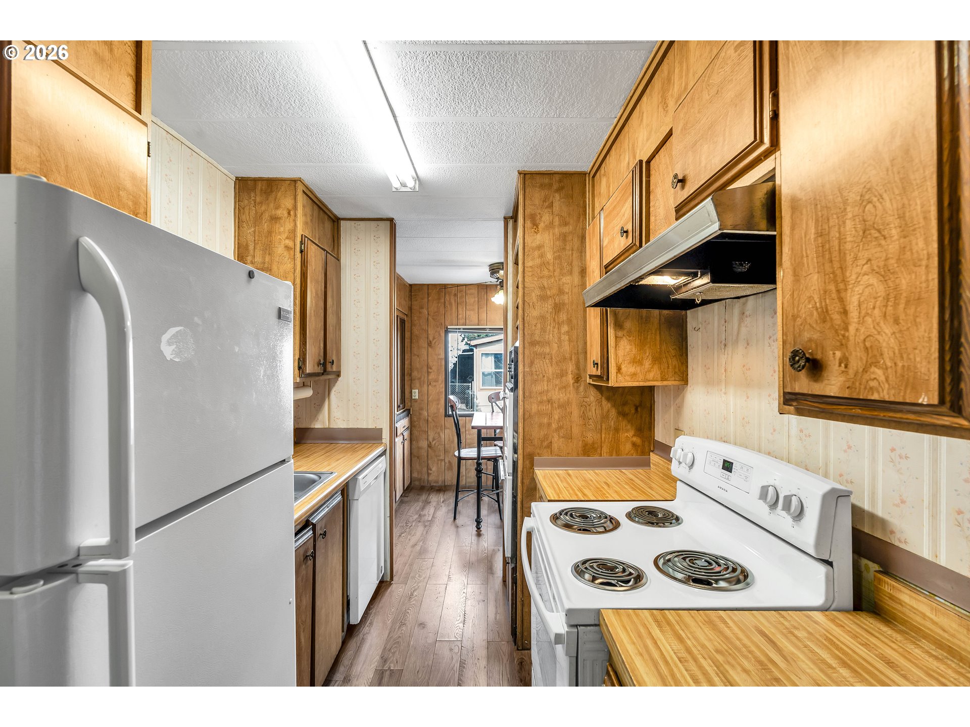 4783 Joyce Street, Unit 93 Keizer, OR 97303 - Photo 12 of 33 a kitchen with stainless steel appliances granite countertop a refrigerator and a stove