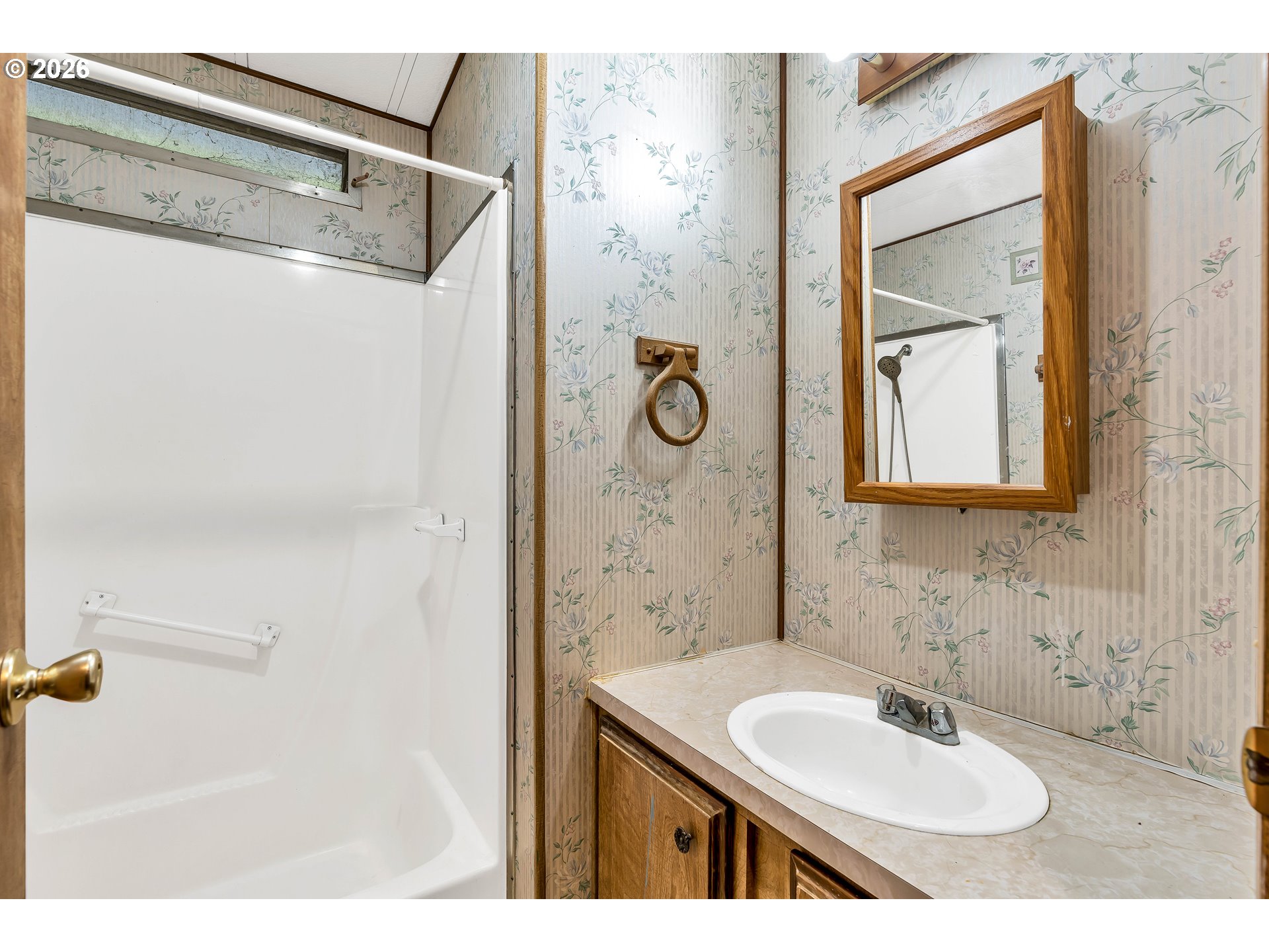 4783 Joyce Street, Unit 93 Keizer, OR 97303 - Photo 14 of 33 a bathroom with a sink and a mirror
