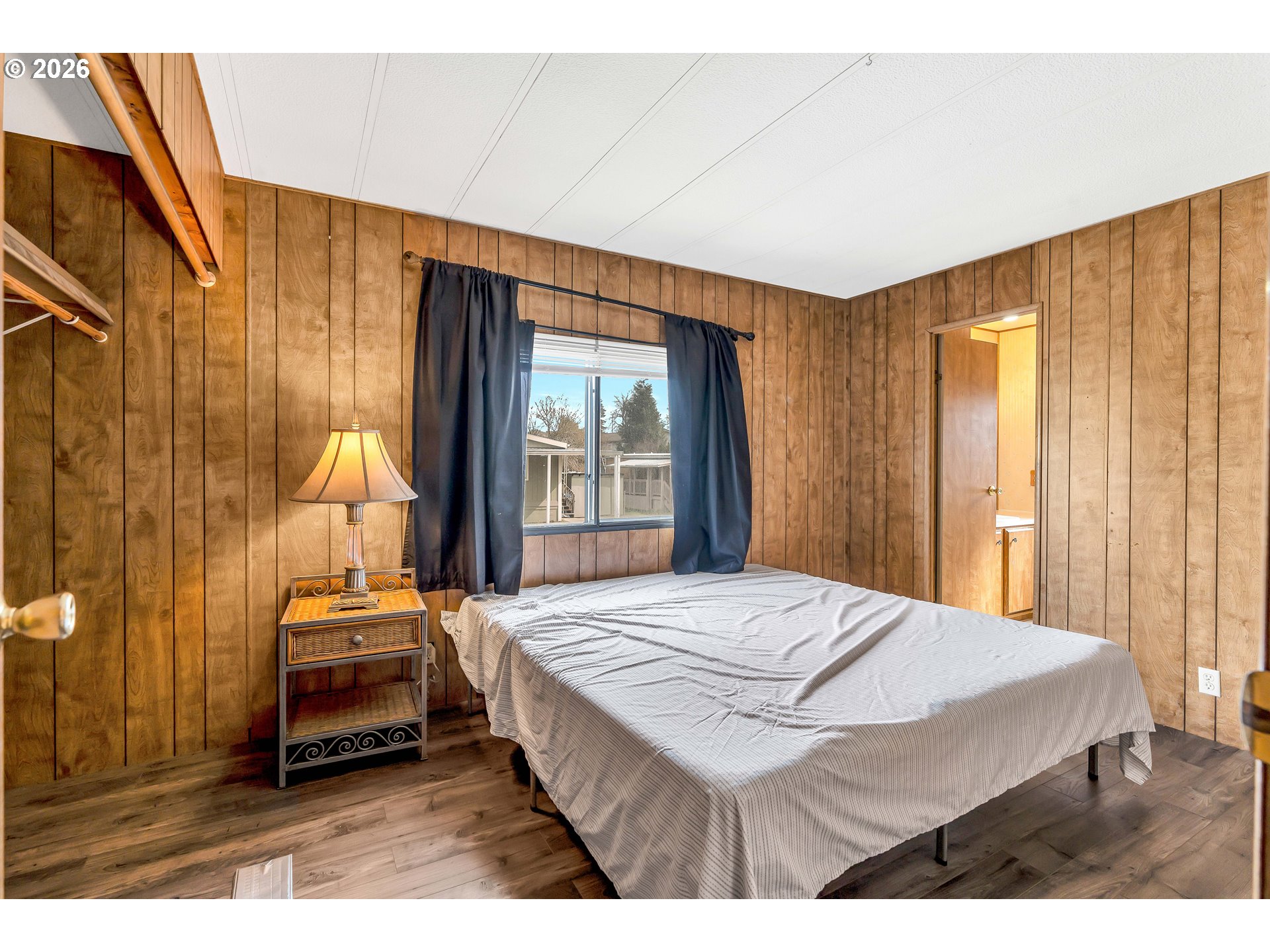 4783 Joyce Street, Unit 93 Keizer, OR 97303 - Photo 16 of 33 a bedroom with a bed and a window